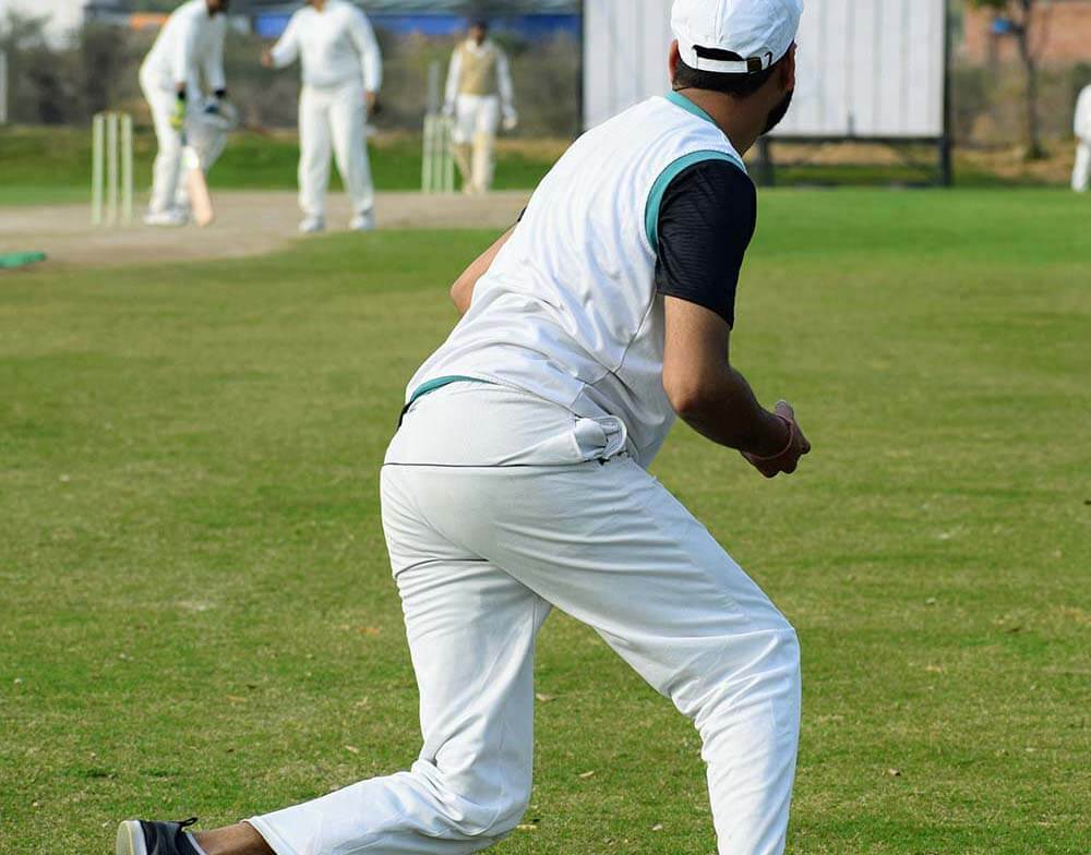 Full length of cricketer playing on field during sunny day, Cric